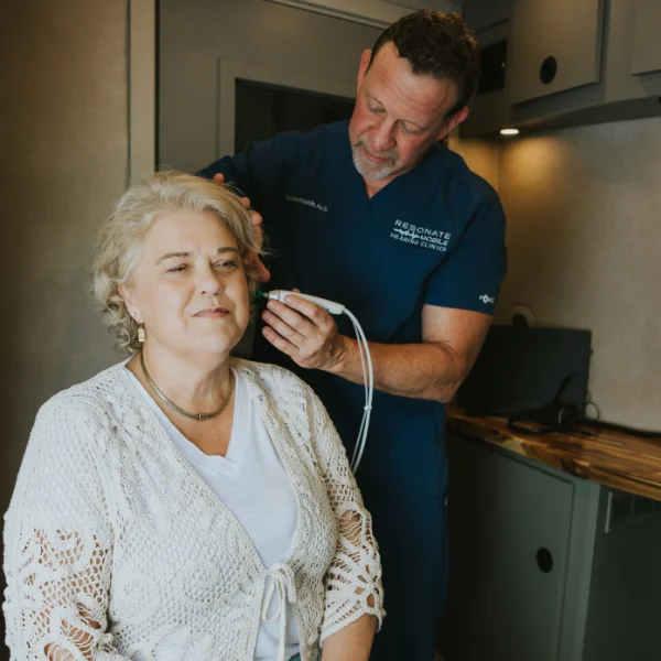 Allan scanning a patient's ear